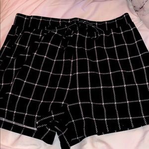 Black and white plaid fabric shorts. High rise